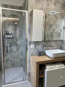 a bathroom with a shower and a sink at La Terrazza di Luca in Tavernelle +40 photos