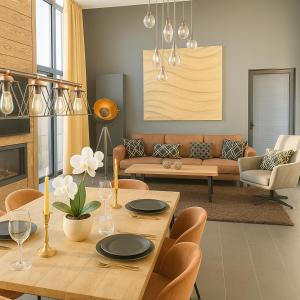 a living room with a table and a couch at Premium-Strand Chalet an der Nordsee - Noordzee - Zeeland in Breskens