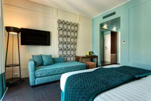 Postel nebo postele na pokoji v ubytování Mascagni Luxury Rooms & Suites