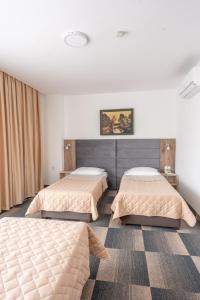 Postel nebo postele na pokoji v ubytování Hotel Slavija