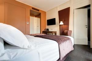 Postel nebo postele na pokoji v ubytování Mascagni Luxury Rooms & Suites
