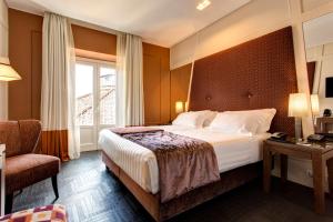 Postel nebo postele na pokoji v ubytování Mascagni Luxury Rooms & Suites