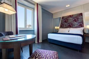 Postel nebo postele na pokoji v ubytování Mascagni Luxury Rooms & Suites