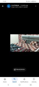 a picture of a bed in a room at Sheetal palce hotel in Ujjain