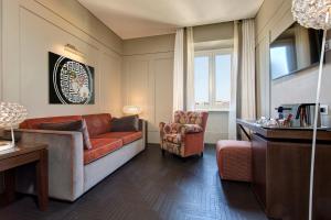 TV a/nebo společenská místnost v ubytování Mascagni Luxury Rooms & Suites
