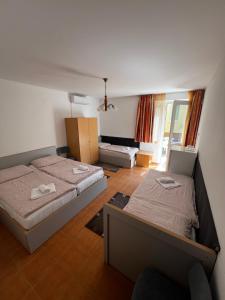 Postel nebo postele na pokoji v ubytování Korona Villa