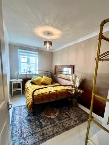 a bedroom with a bed and a rug at Avalon Sunrise our enchanting Glastonbury cottage in Glastonbury