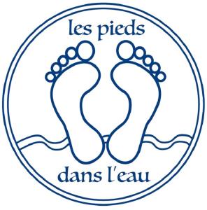 zwei Fußabdrücke im Sand in einem Kreis mit den Worten laspeddsdsds in der Unterkunft Appartement T2 Front de mer avec parking privatif - 4PC216 in Saint Cyprien Plage