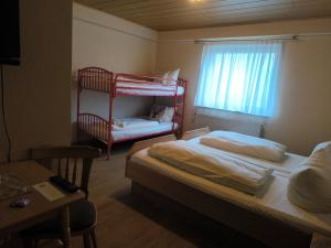 Postel nebo postele na pokoji v ubytování Landgasthof "Zum Schwarzen Roß"