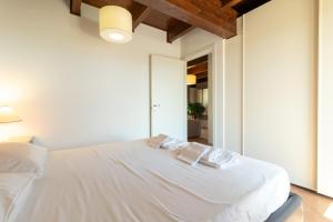 Postel nebo postele na pokoji v ubytování Attico D'amare