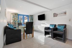 Televisyen dan/atau pusat hiburan di Bäckerhus - Ferienwohnung 1