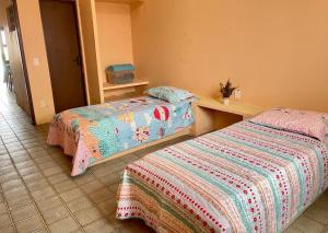 Postel nebo postele na pokoji v ubytování Casa de Praia Cascavel