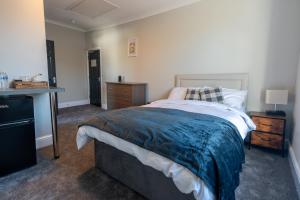 Ένα ή περισσότερα κρεβάτια σε δωμάτιο στο The Great Western