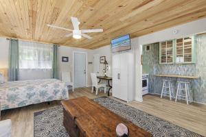 a bedroom with a bed and a ceiling fan at Terrapin Station I in Chicken Island