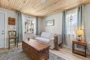 a living room with a couch and a table at Terrapin Station I in Chicken Island