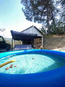 a swimming pool with a cover on top of it at Vardanyan Family Guest House in Shnogh