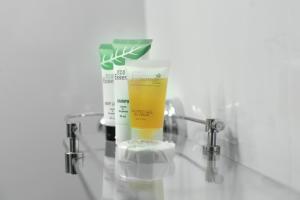 a bottle of sunscreen sitting on top of a glass counter at Ridar Hotel in Seeta