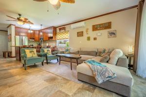 a living room with a couch and a table at Beautiful Beachfront 2br Condo, With Full Kitchen in Tamarindo