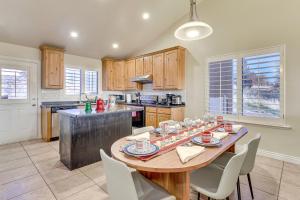 a kitchen with a large wooden table with chairs at Hike, Golf and Ski Family Home in South Jordan in South Jordan