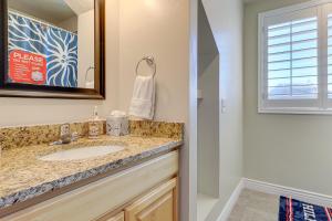 a bathroom with a sink and a mirror at Hike, Golf and Ski Family Home in South Jordan in South Jordan +25 photos