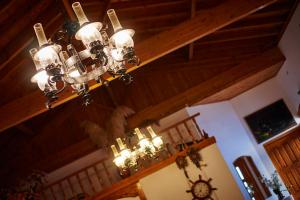 a chandelier hanging from a ceiling in a room at Christinantzela Apartments in Kokkari