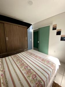 a bedroom with a large bed in a room at Casa Sol e Mar in Governador Celso Ramos