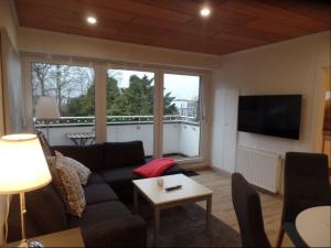 a living room with a couch and a table at Gemütliche Dachgeschoss Wohnung in Selm