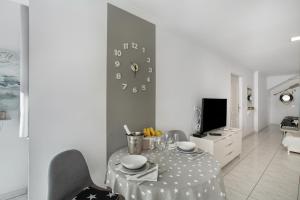 TV a/nebo společenská místnost v ubytování Estrella Del Mar Amazing Loft Casa