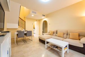 a living room with a couch and a table at Vista Hermosa in Ayamonte