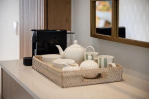 Příslušenství pro přípravu čaje a kávy v ubytování One on Main