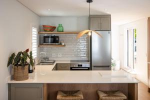 Kuchyň nebo kuchyňský kout v ubytování One on Main