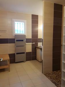 a small kitchen with a window and a sink at Maguy Les Oliviers in Couiza +21 photos