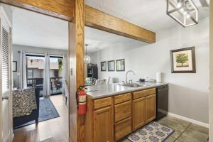 a kitchen with a sink and a counter top at Branson Sunny Daze - Sleeps 4 in Branson +22 photos
