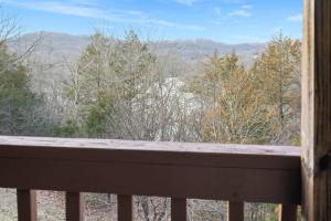 a view of the mountains from a porch at Silver Lake Hideaway - Chic 2 BDR Dog Friendly in Branson