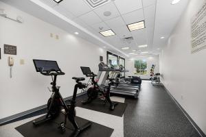 a gym with treadmills and elliptical machines at Hilton Garden Inn New Braunfels in New Braunfels