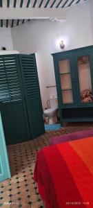 Ένα ή περισσότερα κρεβάτια σε δωμάτιο στο Riad Darko