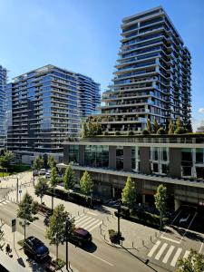 a city with tall buildings and a street with cars at BW Maša in Belgrade