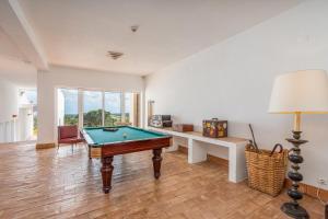 a living room with a pool table in it at Alto da Lua in Bordeira