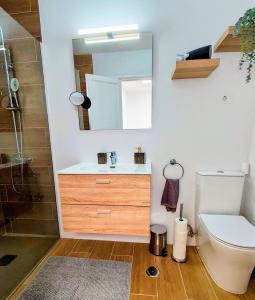 a bathroom with a sink and a mirror at Jandia Mar 4 in Morro del Jable