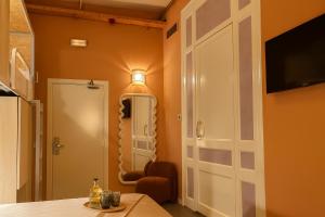 a room with a door and a table and a chair at The Loft House Barcelona in Barcelona +38 photos