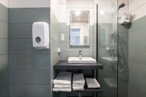 Koupelna v ubytování Hôtel Aragon - Centre ville gare