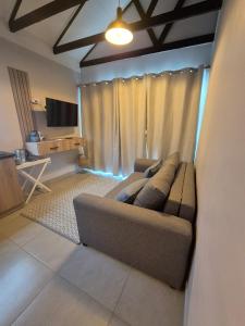a living room with a couch and a television at atnine in Welkom