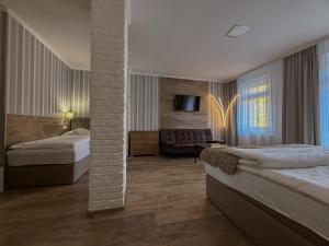 Postel nebo postele na pokoji v ubytování Pension Vzhůru nohama