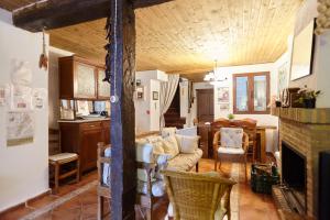a living room with a couch and a fireplace at La Casa De La Abuela Clotilde in Hornos