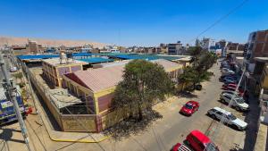 an overhead view of a city with cars and buildings at Huara Hs in Tacna