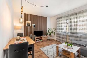 a living room with a dining table and a couch at Fewo45 in Homberg