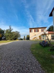 a gravel driveway in front of a house at Podere Sasso 3 in San Gimignano