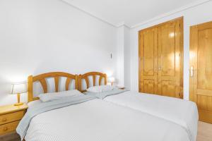 Postel nebo postele na pokoji v ubytování Viñamar 7