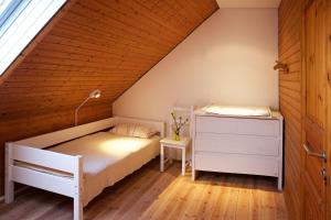 Кровать или кровати в номере Blockhaus Ferien - Ferienhaus Hakon