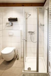 Ванная комната в Blockhaus Ferien - Ferienhaus Hakon